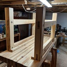 a wooden bench being built in a workshop