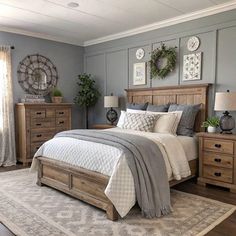 a bedroom with gray walls and wooden furniture