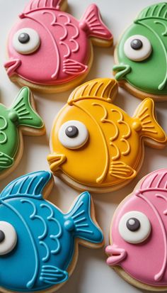 decorated cookies with different colored fish on them