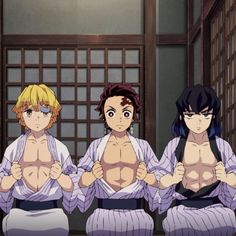 three young men in kimonos standing next to each other