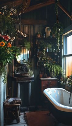 an old fashioned bathtub is surrounded by greenery and potted plants in this rustic bathroom