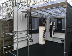 the inside of a boxing gym with punching bags
