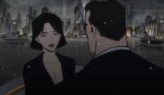 a man and woman looking at each other in front of a cityscape