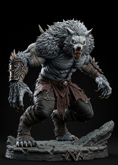 a statue of an evil creature on a rock with his hands in the air and claws out