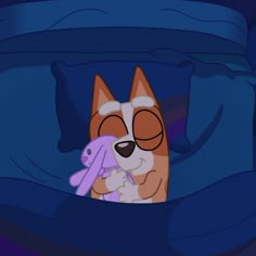 a dog with glasses and a toy in his mouth is hiding under the comforter