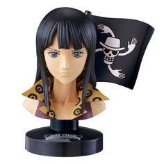 a figurine with a pirate flag and skull on it's head is shown