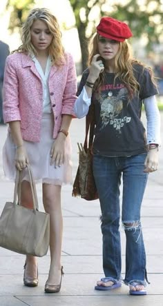 two young women walking down the street together
