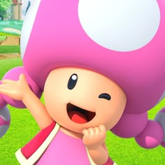 a cartoon character in a pink dress and big mushroom hat with her hands up to her mouth