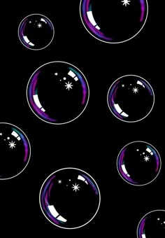soap bubbles floating in the air on a black background with stars and snowflakes
