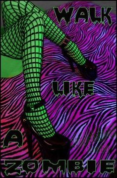 a woman in fishnet stockings and high heels sitting on a zebra print bed sheet