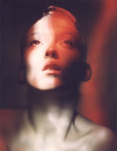a woman's face is shown in this artistic photo
