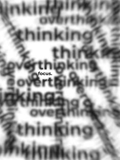 black and white photograph with words in the background that appear to be made out of text