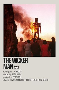 the wicker movie poster with people standing around and looking at fire coming from behind
