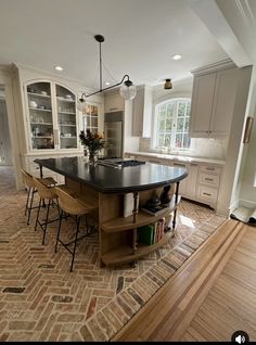 a large kitchen with an island in the middle