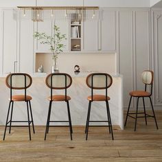 three stools in front of a kitchen island