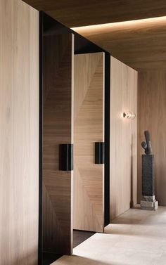 the interior of a house with wooden walls and flooring is lit by recessed lighting