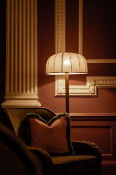 a lamp that is sitting on top of a chair