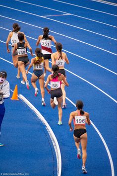 the women are running on the track together