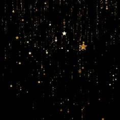 gold stars falling from the sky on a black background