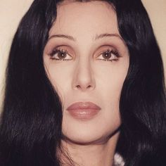 a woman with long black hair and brown eyes