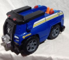 a toy police car is shown on a white background