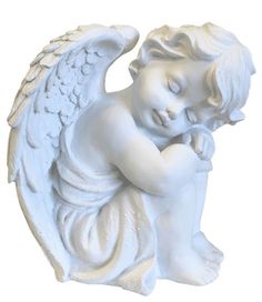 a white statue of an angel with its hands on his chest and eyes closed, sitting in front of a white background