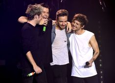 the one direction band members are laughing together