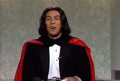 a man in a tuxedo is making a funny face with his mouth wide open
