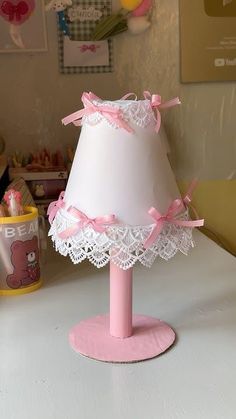 a lamp that is sitting on top of a table next to a teddy bear toy