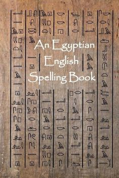 an egyptian english spelling book written in cursive writing on wooden planks with ancient symbols