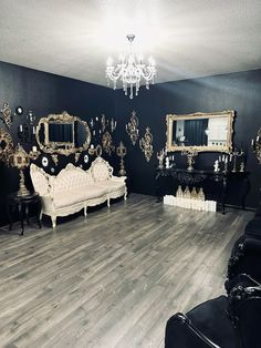 a living room filled with furniture and mirrors