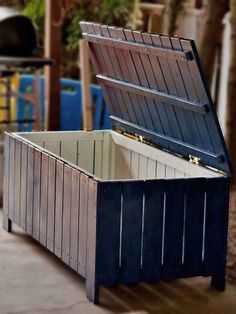 an open chest sitting on top of a sidewalk