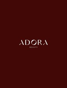 the logo for adora beauty is shown on a dark red background with white lettering