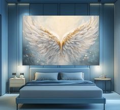 a large painting on the wall above a bed in a room with blue walls and white furniture