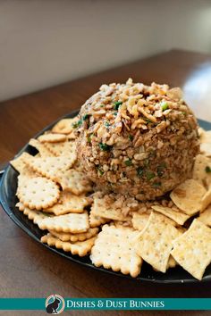 a plate with crackers and an appetizer on it