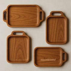 three wooden serving trays with the words autonold global on them