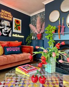 Maximalist living room with red sofa, statement walls, colorful accents, and eclectic decor elements.