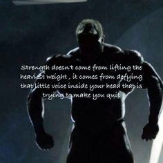 a man standing in the dark with his hands on his hips and an angel above him