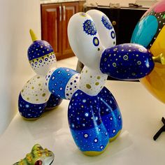 some very pretty colorful balloons in the shape of animals