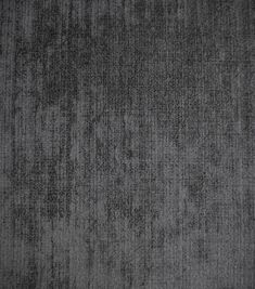an area rug that has been made with dark gray colored material and is very soft