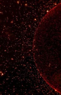 an image of stars in the sky with red and yellow lights on it's side