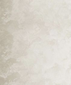 a vase with flowers in it is sitting on the floor next to a white wall