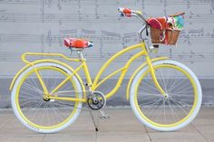 a yellow bicycle parked on the sidewalk with musical notes in the backgroung