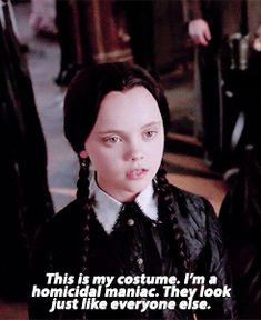 a woman with long braids standing next to another woman