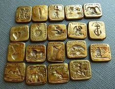 many different types of gold coins on a table