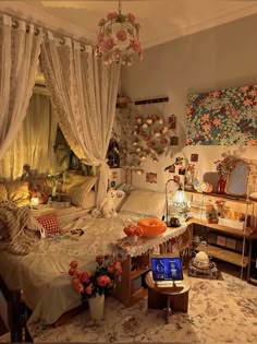a bedroom decorated in white and orange with lots of flowers on the bed, windows, and curtains