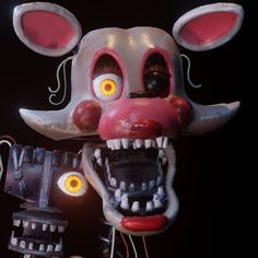 an animal mask with teeth and fangs on it's face is shown in front of a black background