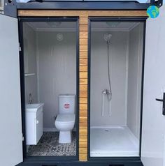 a toilet and shower in a small bathroom