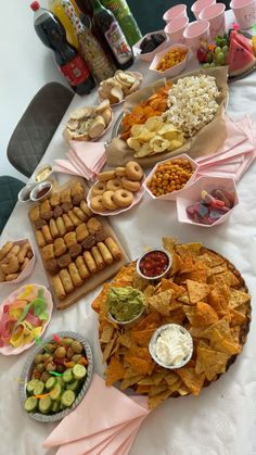 a table filled with lots of food and snacks