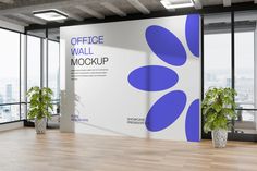 an office wall mockup with two potted plants